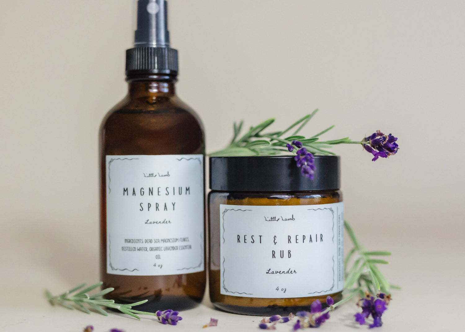Two natural products, a spray bottle and a jar, with lavender flowers on a neutral background.